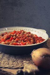 Spicy Chickpea Shakshuka with a grey background