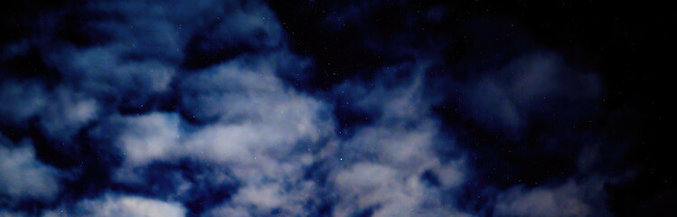 Night sky with clouds and stars.