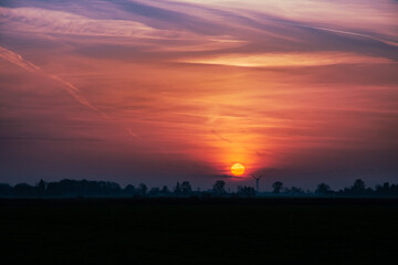 Fototapeta premium sunset over fields