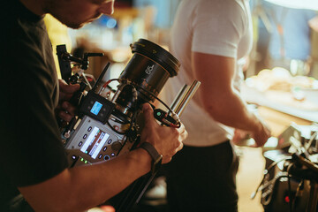 Director of photography with a camera in his hands on the set.