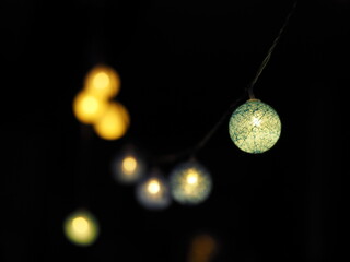 Gold Christmas balls on a black background