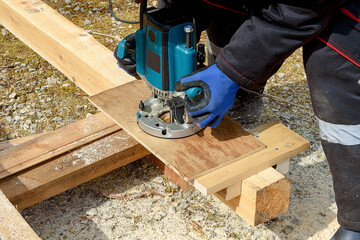 The process of milling wood with a circular machine. Passion for wood carving. Golden hand