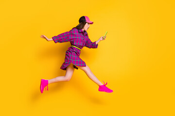 Fototapeta na wymiar Full body profile photo of shocked model read bad news post wear checkered isolated on yellow color background