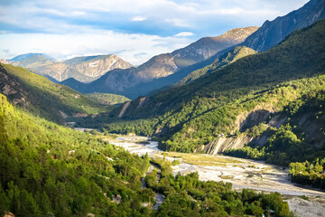 Fototapeta na wymiar River Var, in drought season, crossing forested mountain valleys, commune of Touët-sur-Var, Provence-Alpes-Côte d'Azur region, Alpes-Maritimes, France