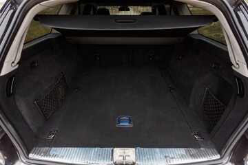 Car parked on the road in the forest, travel stop, open trunk