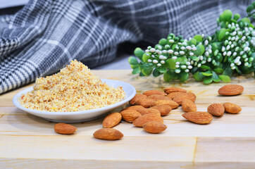 Almond flour pile from top on wooden background