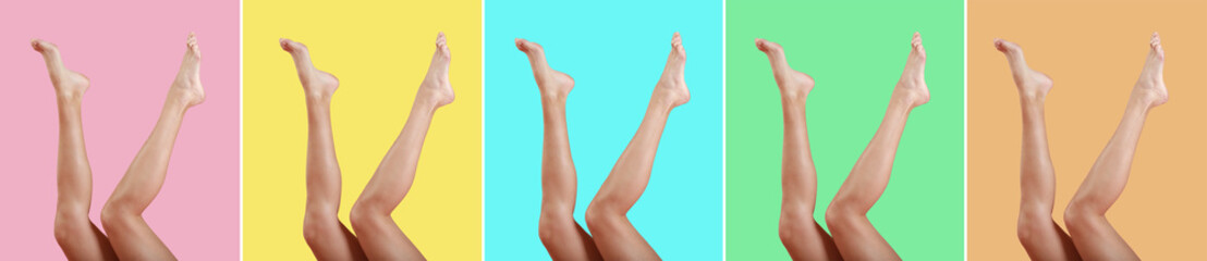 Beautiful female legs on color background