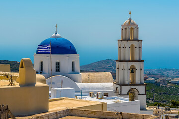 Fototapeta na wymiar A view towards the Church of Christ in the village of Pyrgos, Santorini in summertime