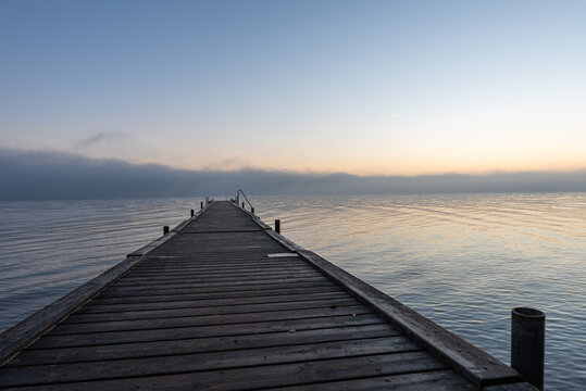 grey wooden jetty  in the calm sea