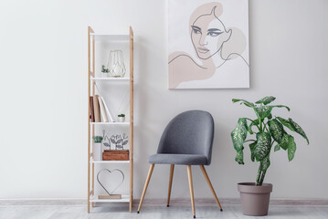 Interior of modern stylish room with chair and shelf unit