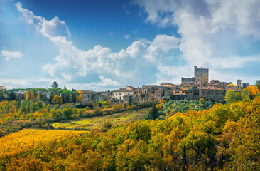 Fototapeta na wymiar Castellina in Chianti village and autumn foliage. Tuscany, Italy