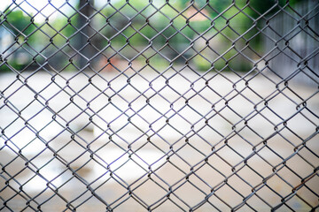 Close-up chain link fence , Sunset background