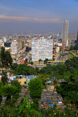 Naklejka premium BOGOTA,COLOMBIA/MARCH 15,2018:Panoramic view of the city of Bogota. In the foreground are slum roofs.