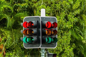 Confusion as all traffic lights show at the same time.