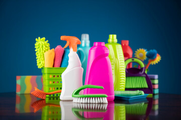 House and office cleaning theme. Colorful cleaning kit on blue background.