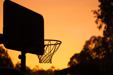 Basketball net silhouette in a golden sunrise