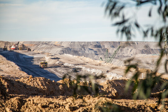 Open cut coal mine with dump truck moving dirt