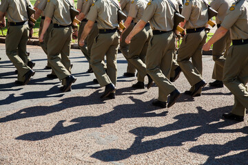 Shadows and legs of marching soldiers in the Australian Defense Force