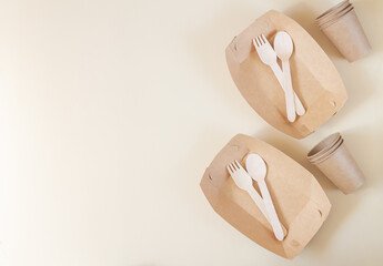 Zero waste tableware, plastic free concept, biodegradable paper plate, cutlery, cup on beige...