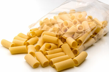 Paccheri macaroni Italian dry raw pasta bronze drawn, rough paste from Gragnano,Naples,Italy, in transparent packaging on white background