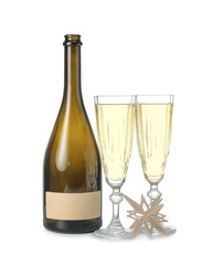 Bottle and glasses of champagne on white background. New Year celebration