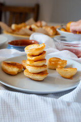 Delicious pancakes stack like cake. Breakfast in a plate for children on a white table