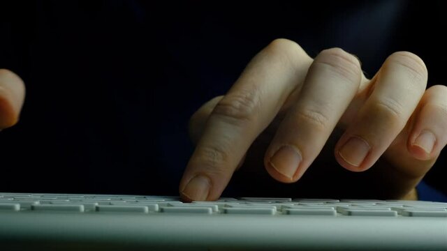 Typing on keyboard. Hands and fingers close-up typing on keyboard. Sliding camera. Using technology working productive.