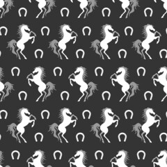Obraz premium White horse and horseshoe silhouette seamless pattern. Vector illustration.