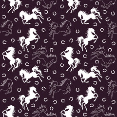 White horse and horseshoe silhouette seamless pattern. Vector illustration.