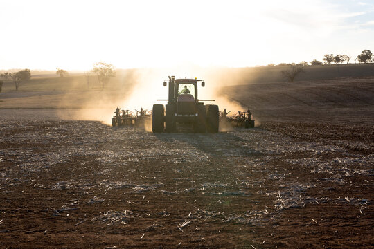 Tractor and airseeder planting wheat on a farm