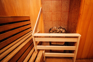 Fototapeta na wymiar Sauna steam bath inside with stones and stove