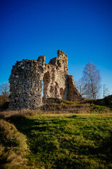 Ruined medieval castle in Aizkraukle, Latvia in sunny day.