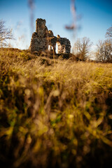 Ruined medieval castle in Aizkraukle, Latvia in sunny day.