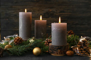 Christmas composition with aroma candles on dark background