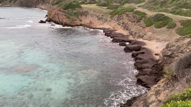 cliff with stormy sea in the crystalline sea of ​​southern Sardinia

