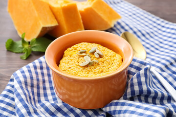 Tasty pumpkin pudding on table