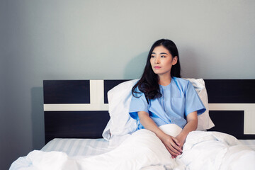 Asian woman patient resting in bed at hospital private room with illness disease sickness unhealthy mind, panic patient in medical health care insurance, feeling loneliness sad depression unhappy