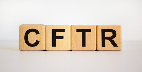 CFTR medical concept. Wooden cubes with the inscription 'CFTR - cystic fibrosis transmembrane regulator'. Beautiful white background. Copy space.
