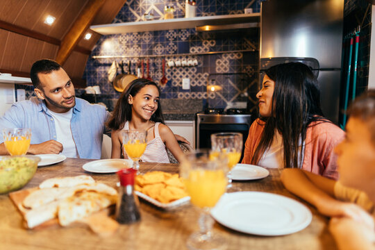 Latin Family Having Dinner At Home