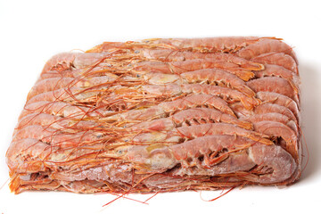 Large fresh frozen langoustines are beautifully arranged on a white background