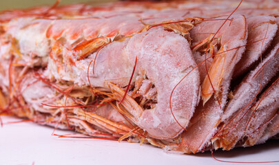 Fresh, red, large frozen Argentine langoustines, seafood, close-up