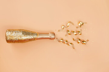 Sparkling wine, gold champagne bottle with glitter.