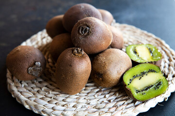 kiwi on black  background. tinting. selective focus