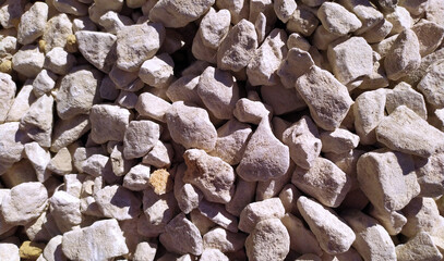 Yellow gravel close-up. View from above. A place for text. Texture. Background. Gravel takes the whole frame. A builder. Material.