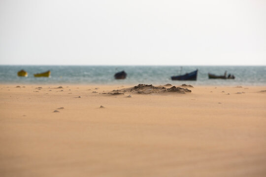 Beach, wind and fishing boats in Sidi Kaouki