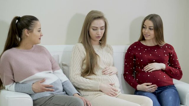 Pregnant girls waiting doctor in the waiting room