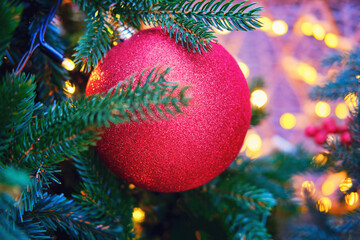 Winter christmas tree with red baubles and ball, close up