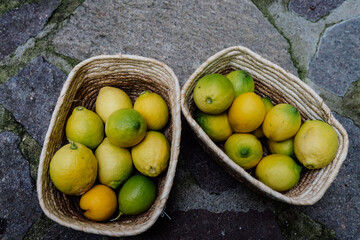 detail of two baskets of freshly picked lemons