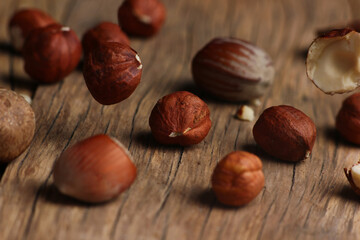 inshell hazelnuts close - up on a wooden board background