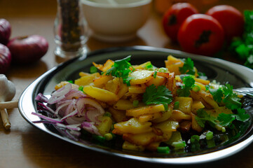 Fried potatoes with onions and cilantro